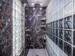 An extra large shower complete with shampoo, conditioner, body wash, body sprays, and a ceiling rain head for the spa treatment you deserve.